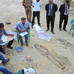 Workers at the mass grave in Jaffna; more than 200 skeletons have been dug up in recent months | Salil Bera