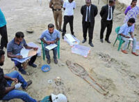 Workers at the mass grave in Jaffna; more than 200 skeletons have been dug up in recent months | Salil Bera