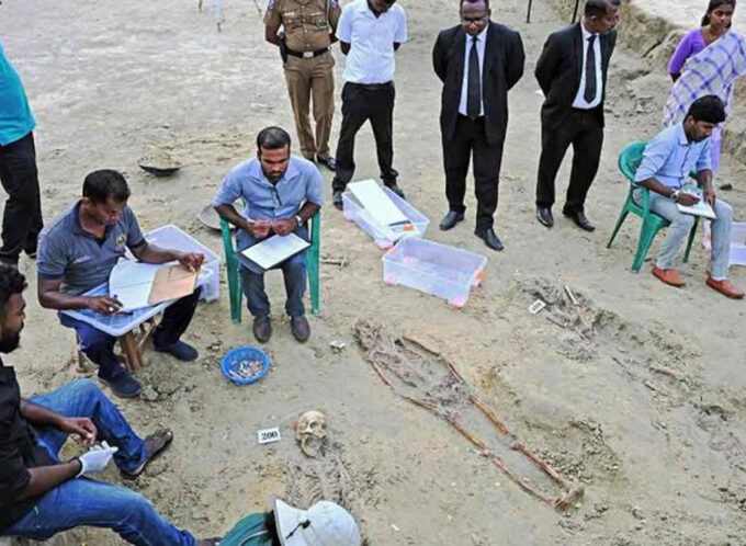 Workers at the mass grave in Jaffna; more than 200 skeletons have been dug up in recent months | Salil Bera