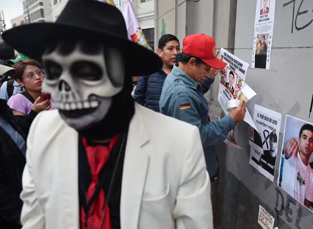 People attend a vigil in memory of Mauricio Ruiz, a 32-year-old rapper killed in Wednesday's protests against Peruvian President Jose Jeri, in Lima, Peru, on October 16, 2025 [Sebastian Castaneda/Reuters]