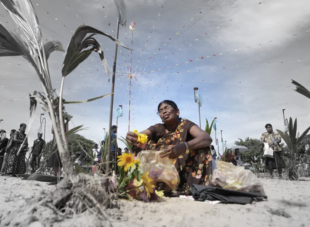Families mourn victims of Sri Lanka’s 1983-2009 civil war on the beach at Mullivaikal where the final battle took place, May 17, 2024. © 2024 Eranga Jayawardena/AP Photo